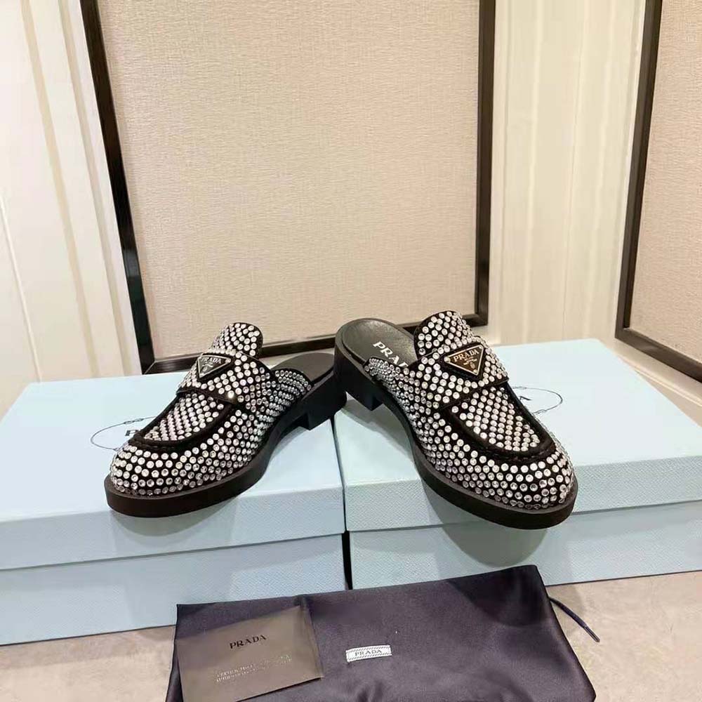 Angle showing 40mm heel and slip-on silhouette of Prada Satin Mules