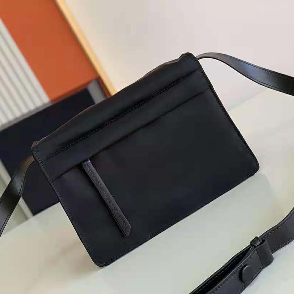 Side angle showing silver hardware and zip closure on Prada Women Small Padded Re-Nylon Shoulder Bag-Black