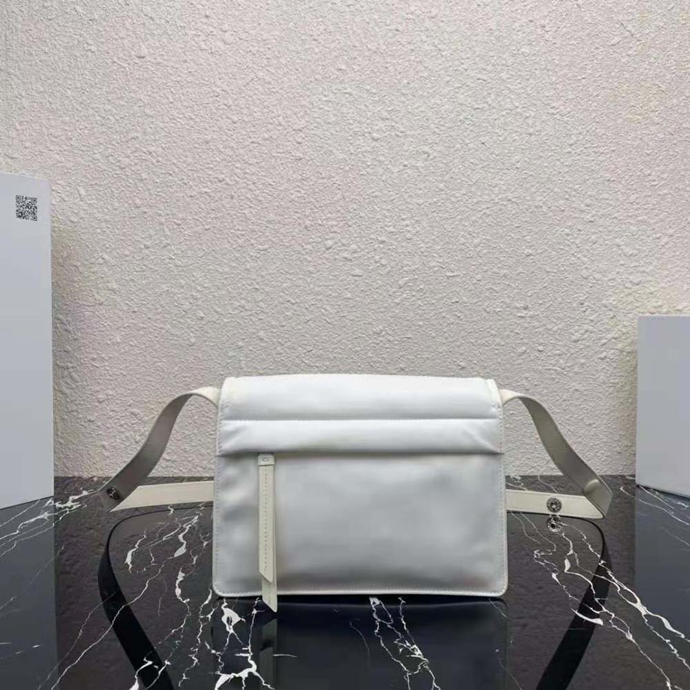 Side angle showing padded texture and zip closure on Prada shoulder bag
