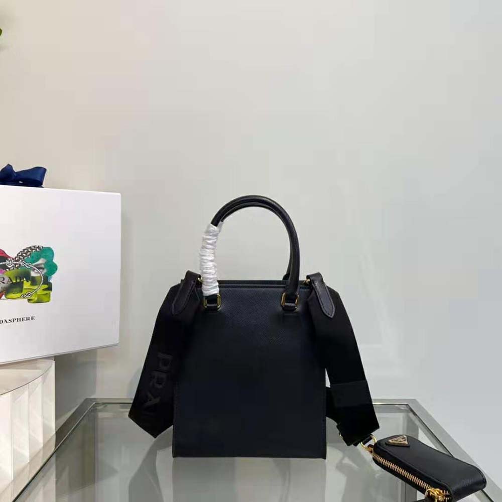 Side profile showing compact silhouette of Prada Women Small Saffiano Leather Handbag-Black