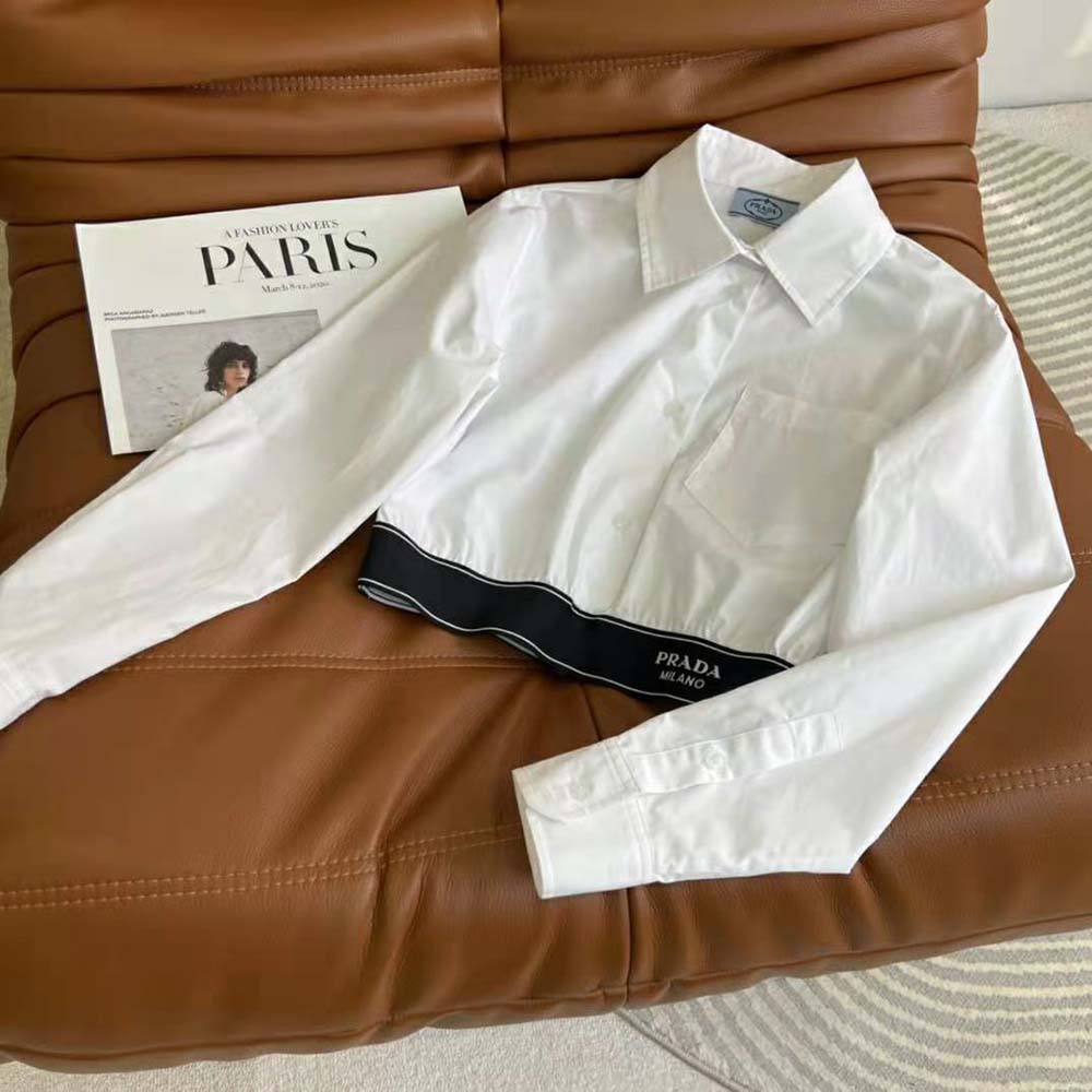 Close-up detail of buttons and fabric texture on Prada Women Stretch Poplin Shirt with a Hybrid Design Reinvents