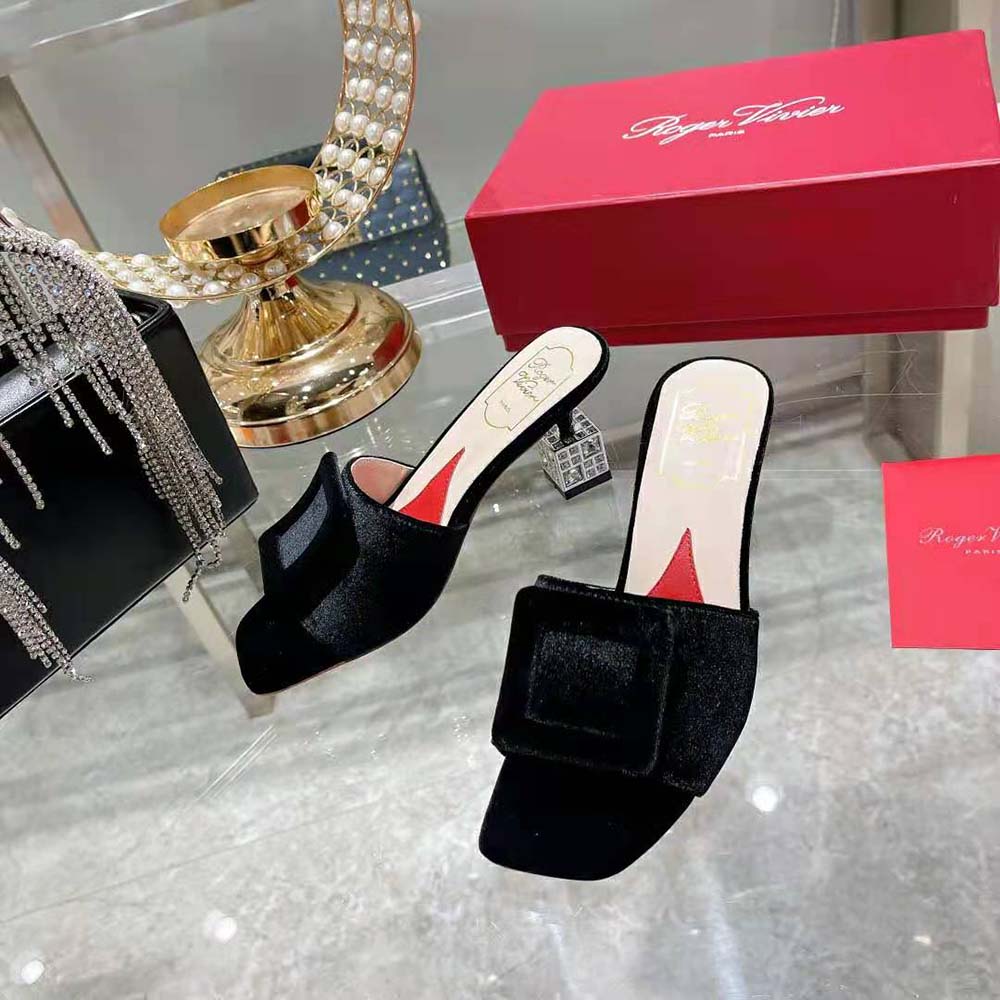 Close-up of sparkling strass heel detail on Roger Vivier black satin mules