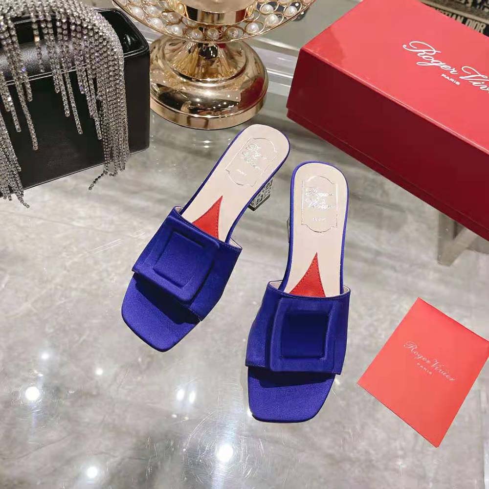 Close-up on the sparkling strass cube heel of Roger Vivier mules