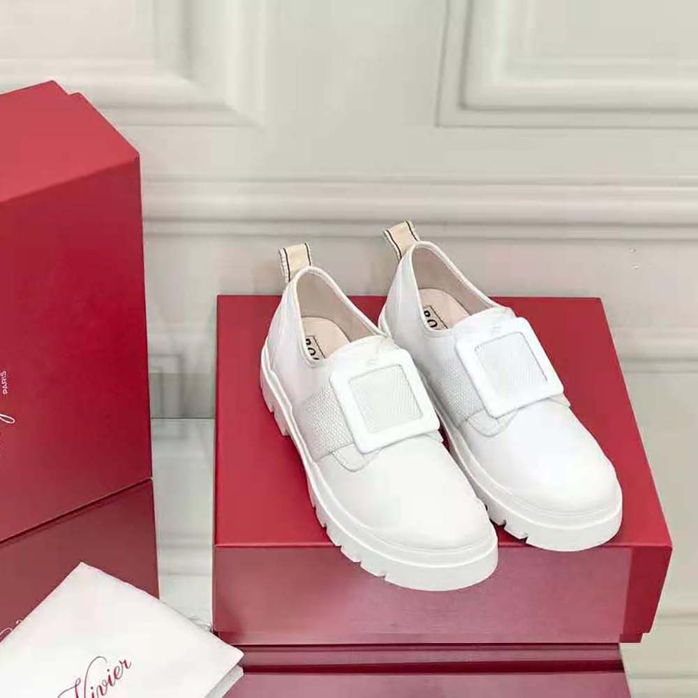 Close-up of lacquered buckle detail on Roger Vivier Women Walky Viv’ Sneakers in white