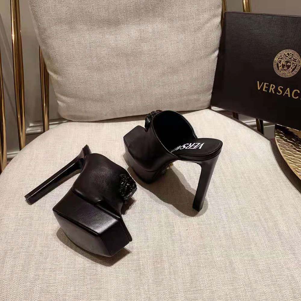 Close-up of gold Medusa hardware on Versace Women La Medusa Platform Mules