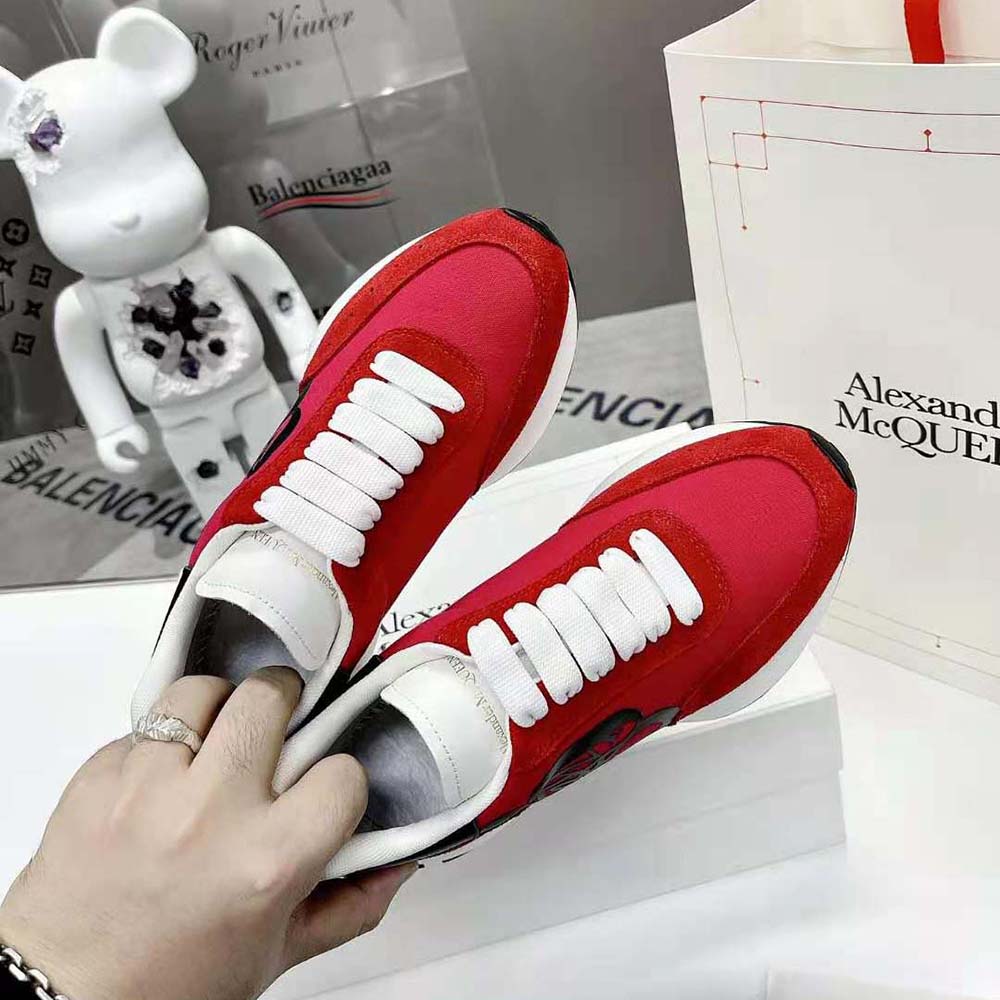 Top angle showing premium leather texture of Alexander Mcqueen Sprint Runner in red