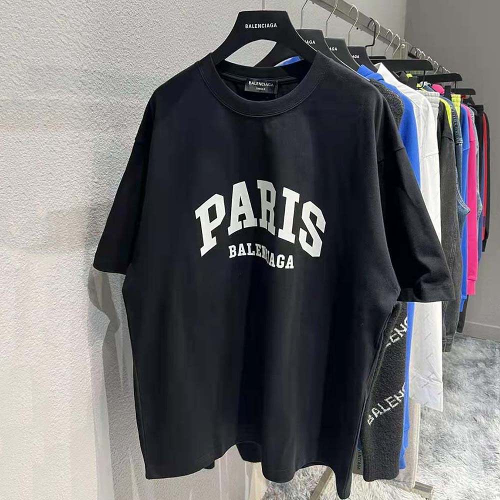 Close-up of black cotton fabric and Balenciaga logo on T-shirt