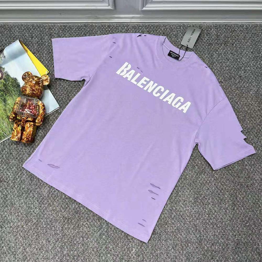 Close-up of destroyed sleeve detail on Balenciaga purple T-shirt