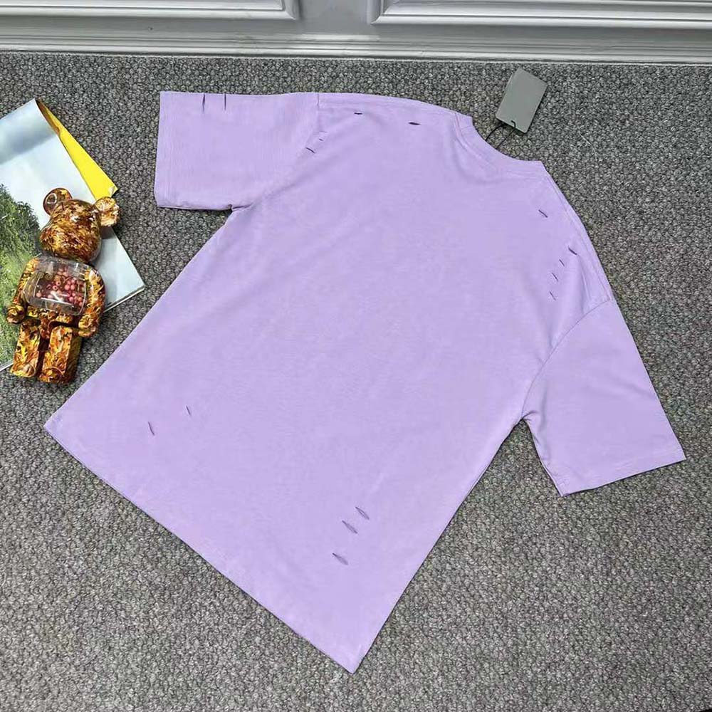 Side angle showing boxy fit of Balenciaga Women Destroyed T-shirt