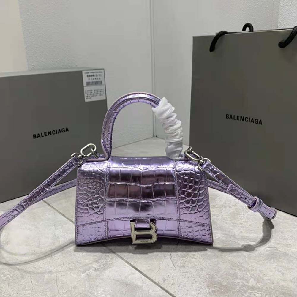 Close-up of purple crocodile embossing and silver hardware on Balenciaga handbag