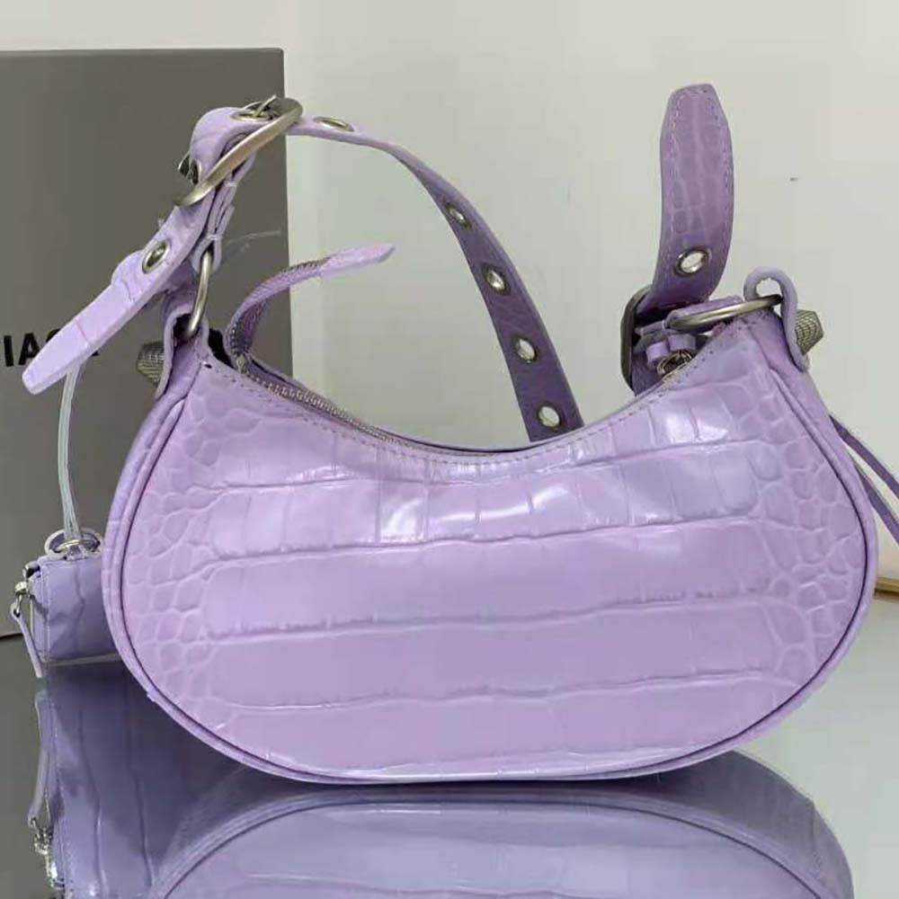 Side angle showing zip closure on Balenciaga Women Le Cagole XS Shoulder Bag
