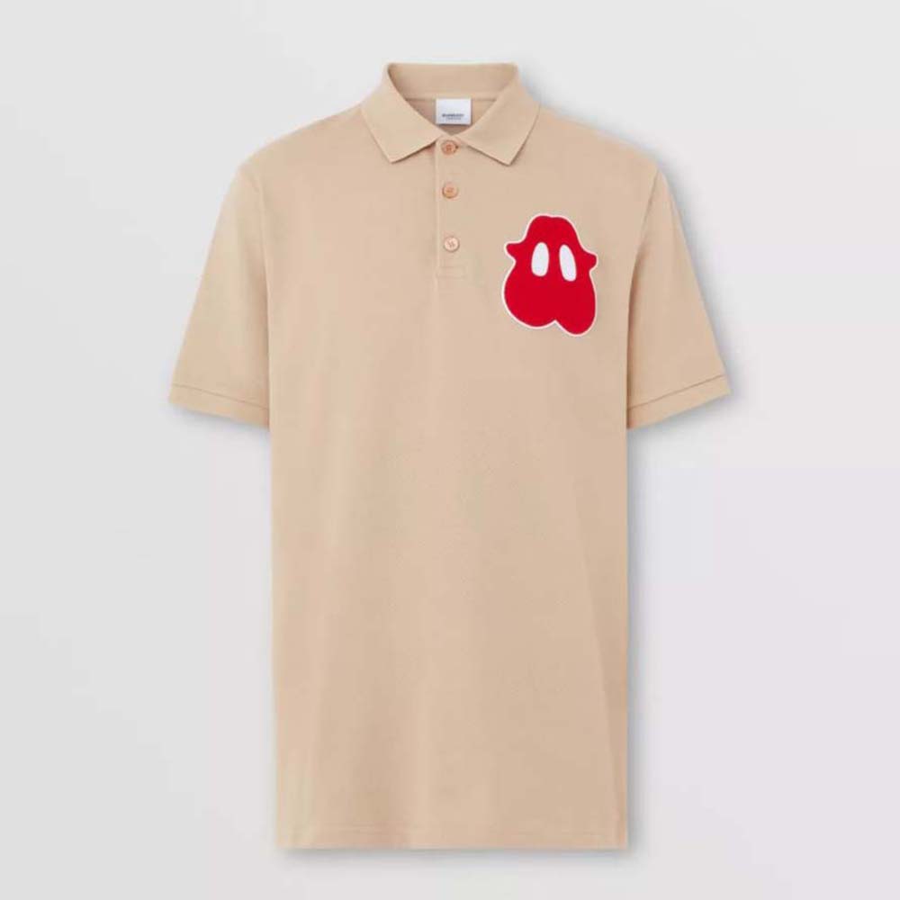 Front view of Burberry Men Monster Graphic Cotton Pique Oversized Polo Shirt-Sandy