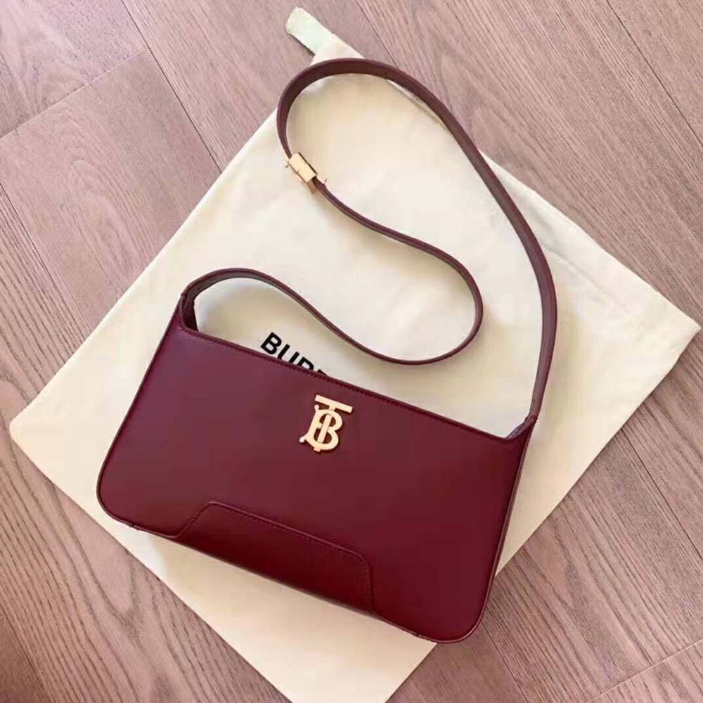 Close-up of gold TB monogram hardware on Burberry Women Leather TB Shoulder Bag