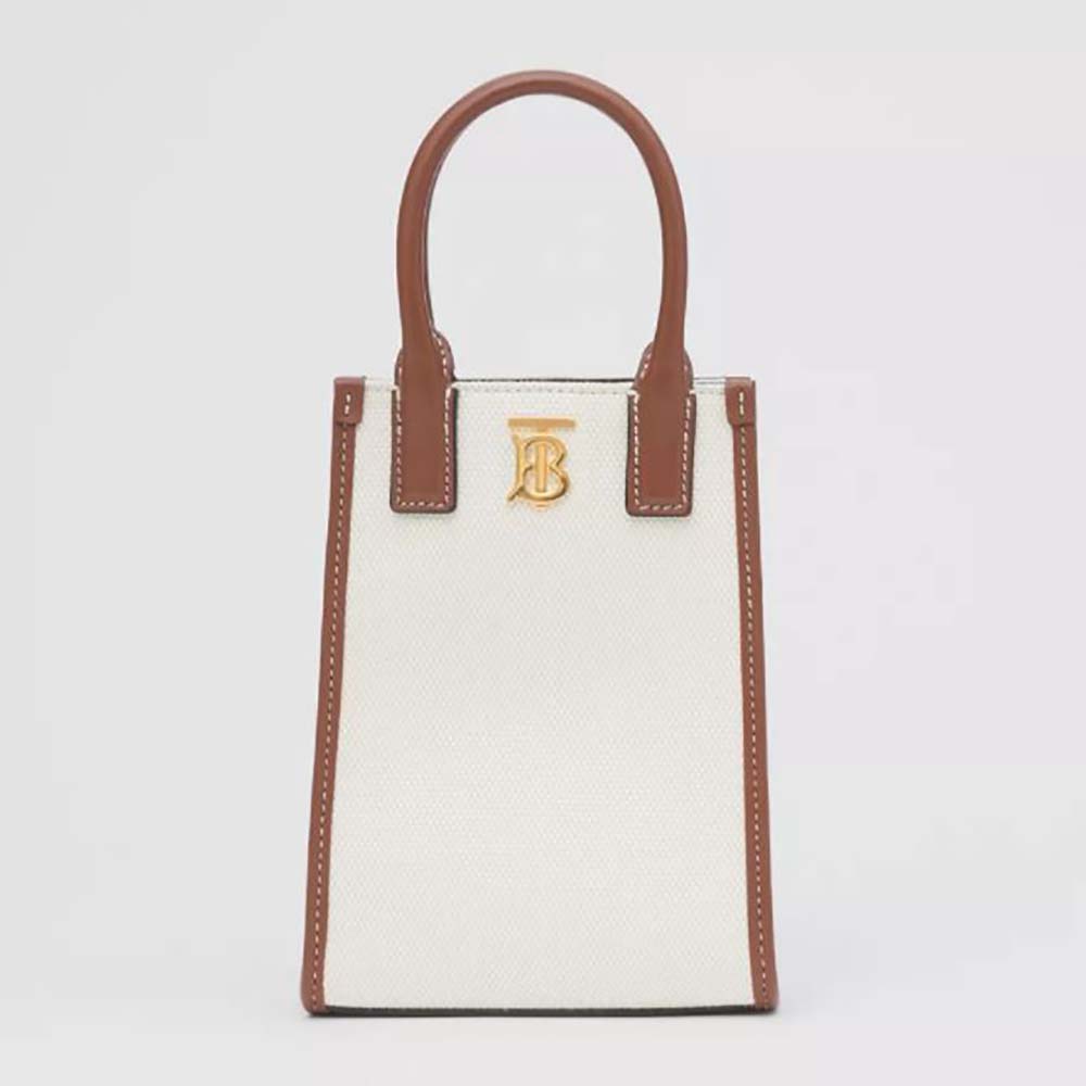 Front view of Burberry Women Micro Monogram Motif Canvas and Leather Tote in white