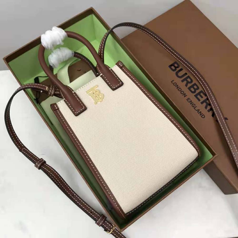 Side angle showing the leather trim and zip closure on Burberry tote