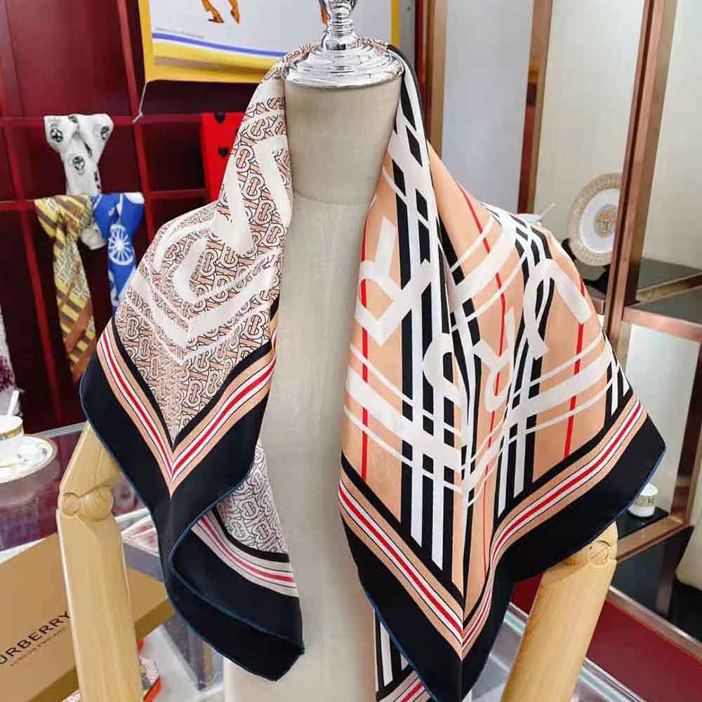 Detail of hand-rolled edges on Burberry Women Montage Print Silk Square Scarf
