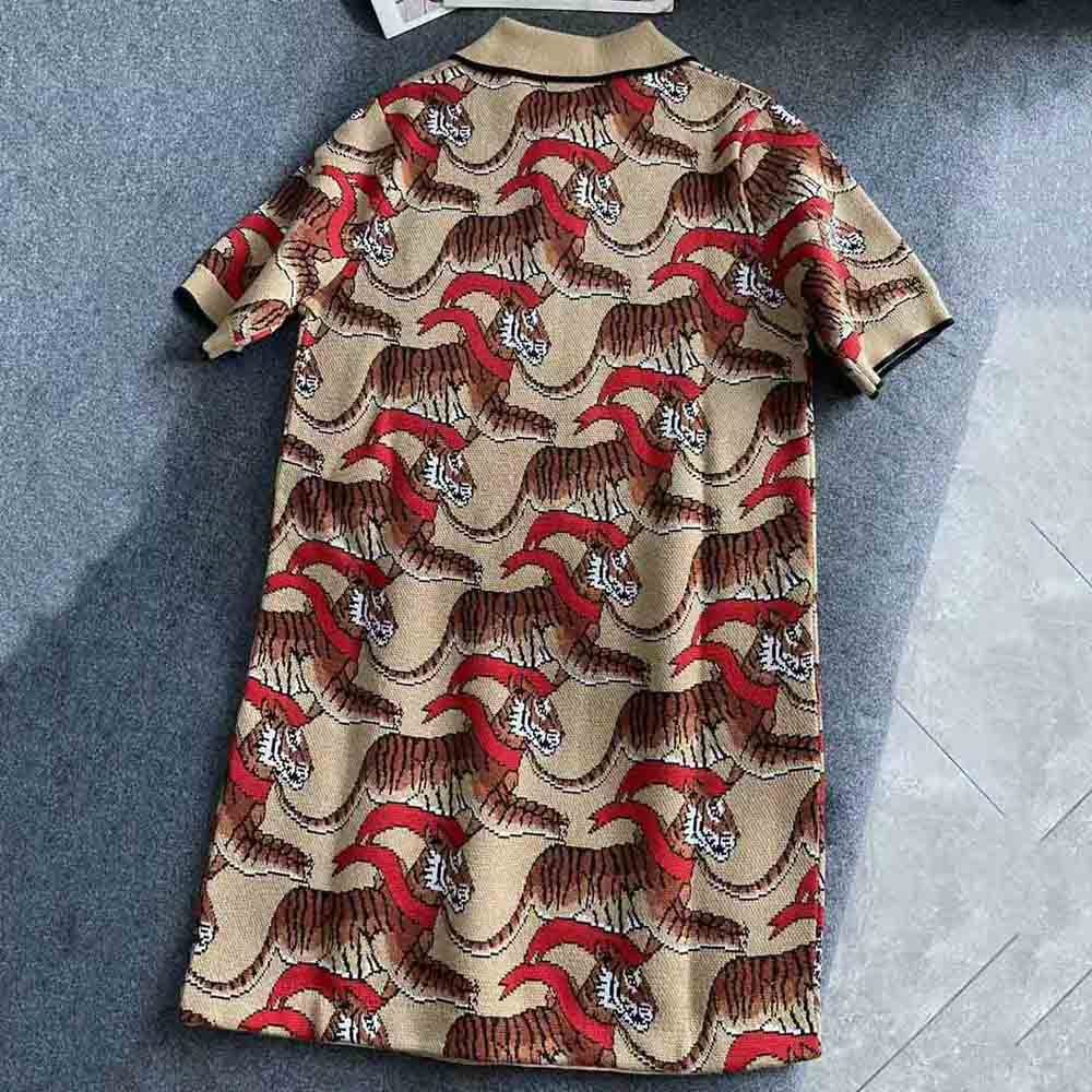 Side angle showing tailored silhouette of Burberry Tiger Graphic dress