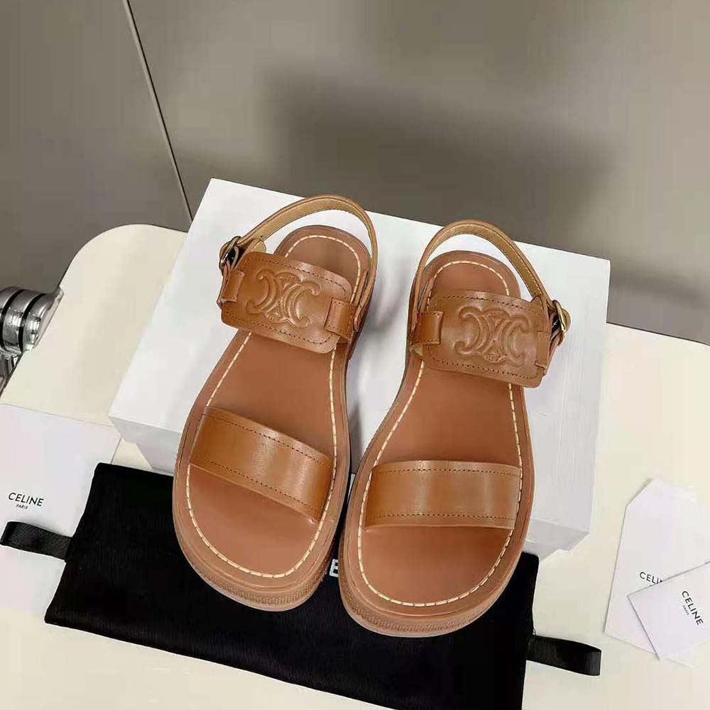 Close-up of gold Triomphe buckle on Celine Women Clea Triomphe Sandal