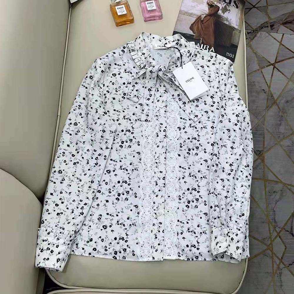 Close-up of button closure and cotton voile fabric on Celine shirt
