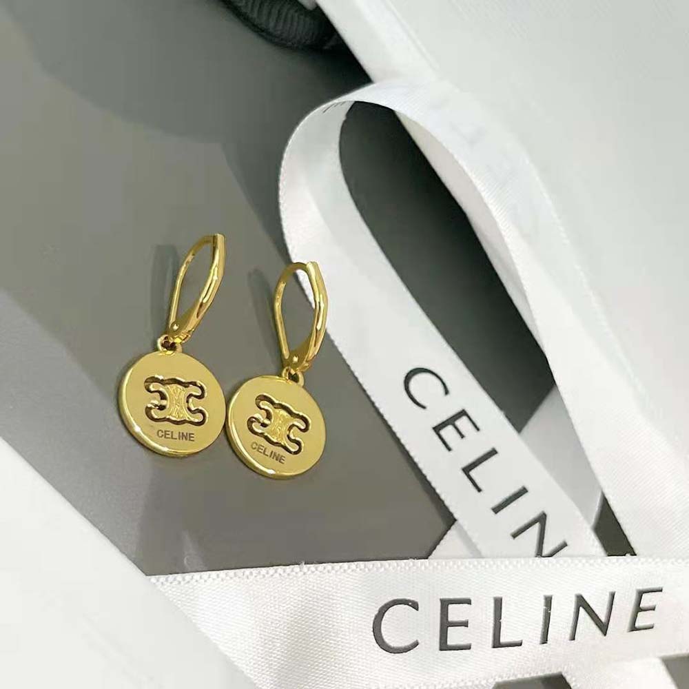 Close-up showing engraved Triomphe detail on Celine swivel earrings