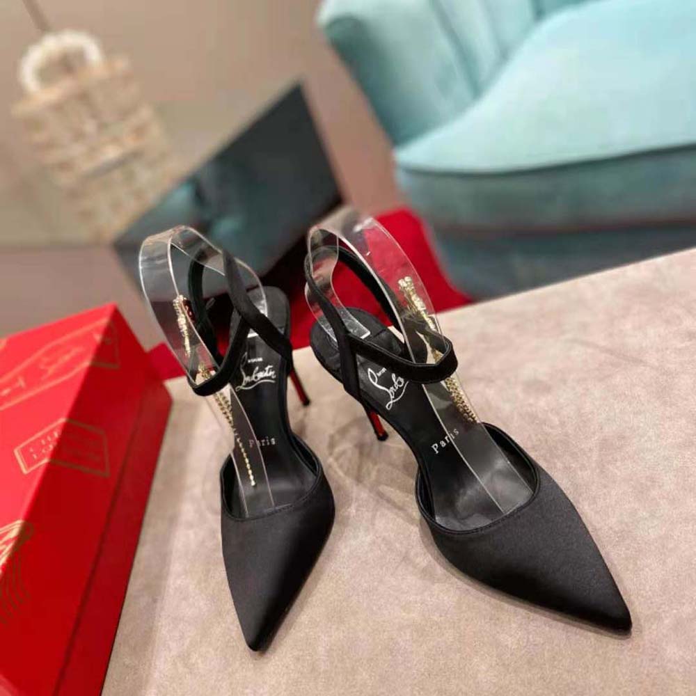 Close-up of red lacquered sole on Christian Louboutin Women Goldina heels