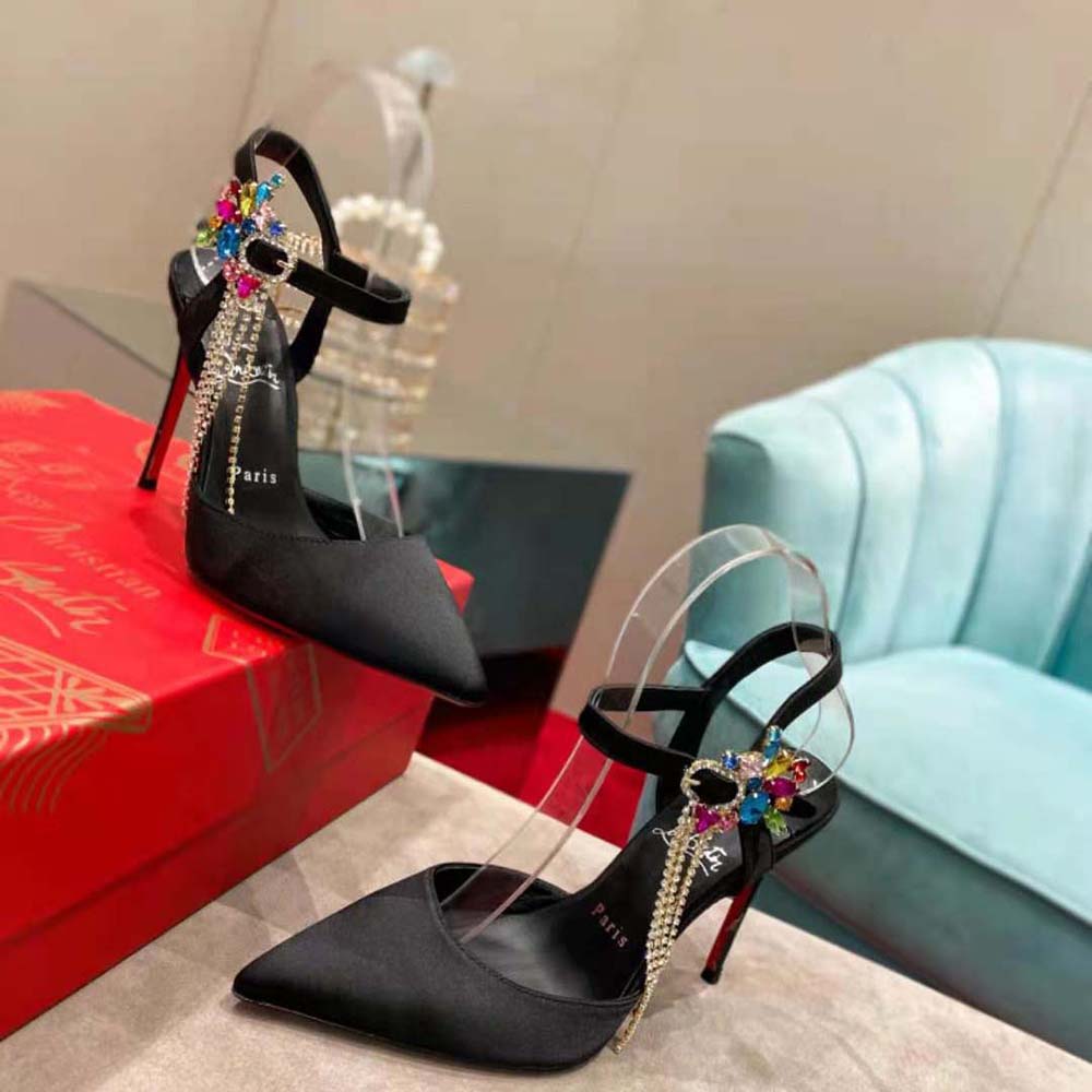 Elegant front angle showing black leather straps on Christian Louboutin Goldina