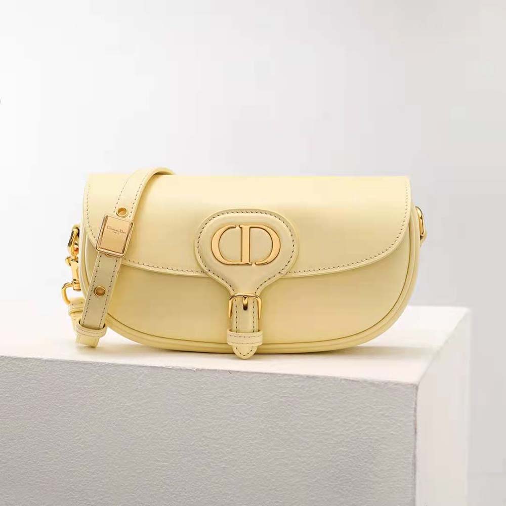 Close-up of gold CD clasp on Dior Women Bobby East-West Bag