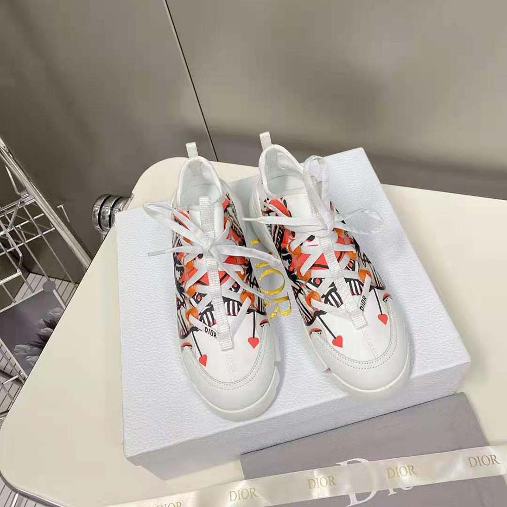 Close-up of red and black Cupidon print on Dior Women D-Connect Sneaker