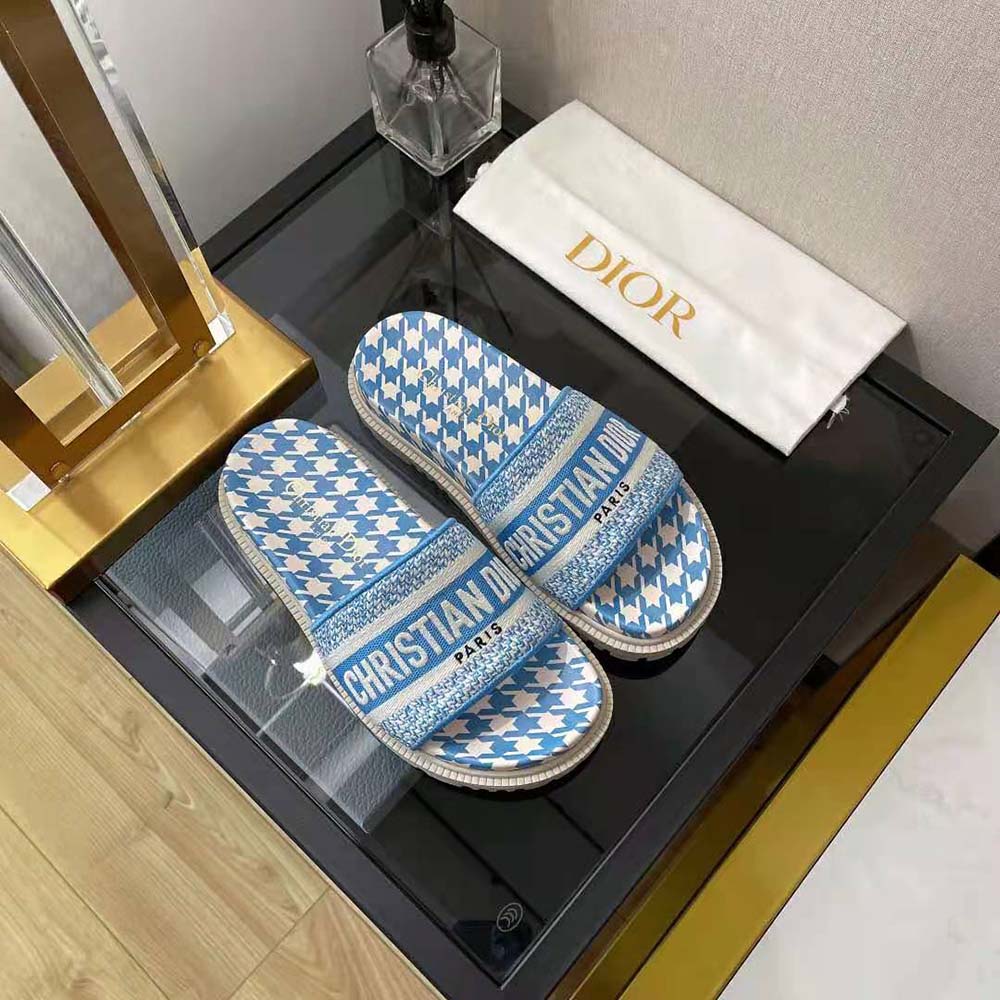 Top view showing gold-tone Dior logo hardware on Cornflower Blue slide