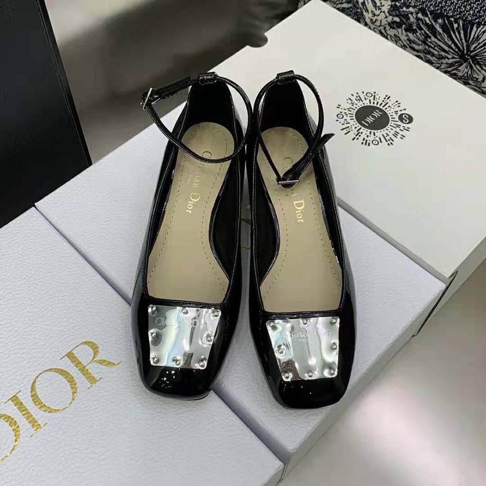Close-up of black patent calfskin and Dior hardware detail