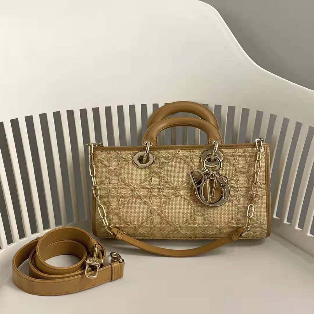 Close-up of gold-tone ‘D’ charm on Lady D-Joy Bag Natural Cannage Raffia