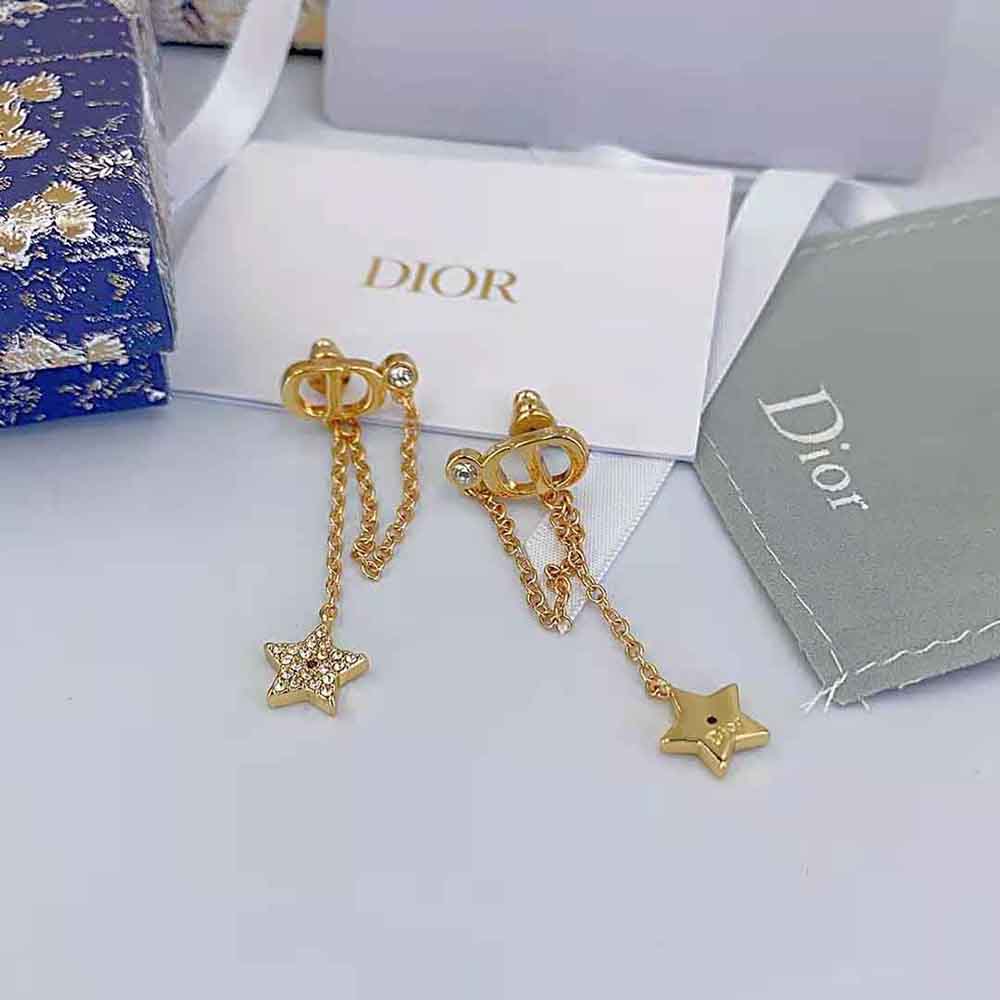 Close-up of white crystals and gold-finish metal on Dior Petit CD Earrings