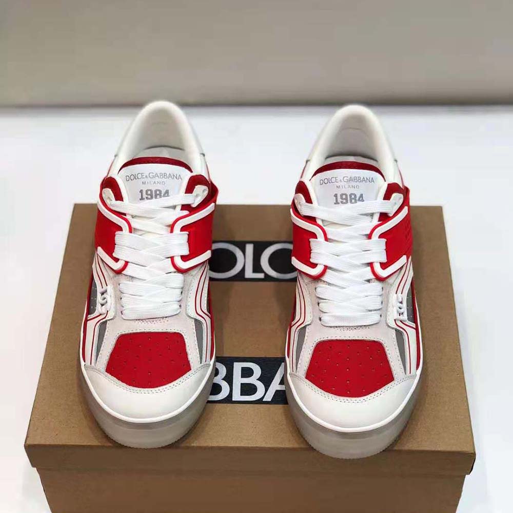 Close-up of red calfskin leather and metallic D&G logo on sneakers