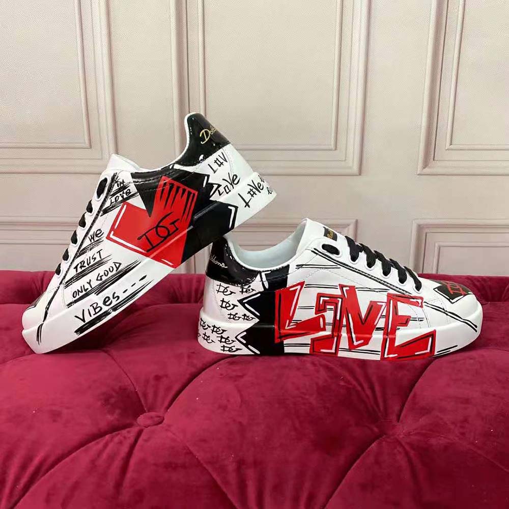 Close-up of red leather and D&G logo hardware on Valentine s Day Portofino Sneakers
