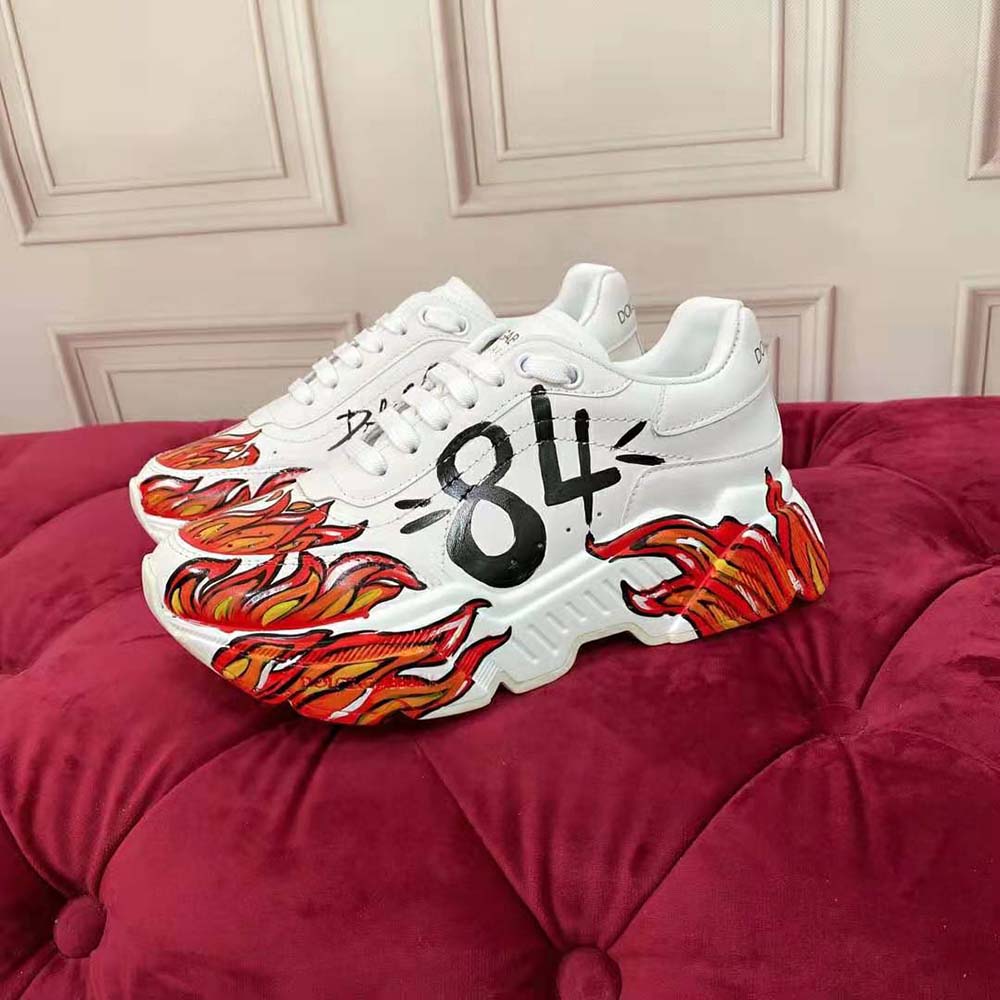 Top angle showing branded D&G hardware on Daymaster red sneakers