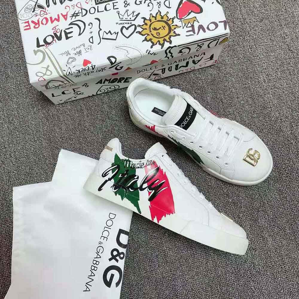 Close-up of printed D&G logo detail on white calfskin Portofino sneakers
