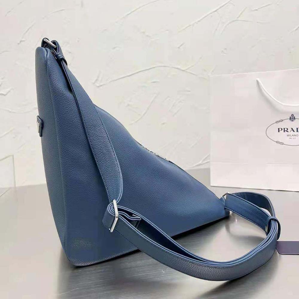 Side angle showcasing the silhouette of Prada Men Leather Prada Triangle Bag-Navy