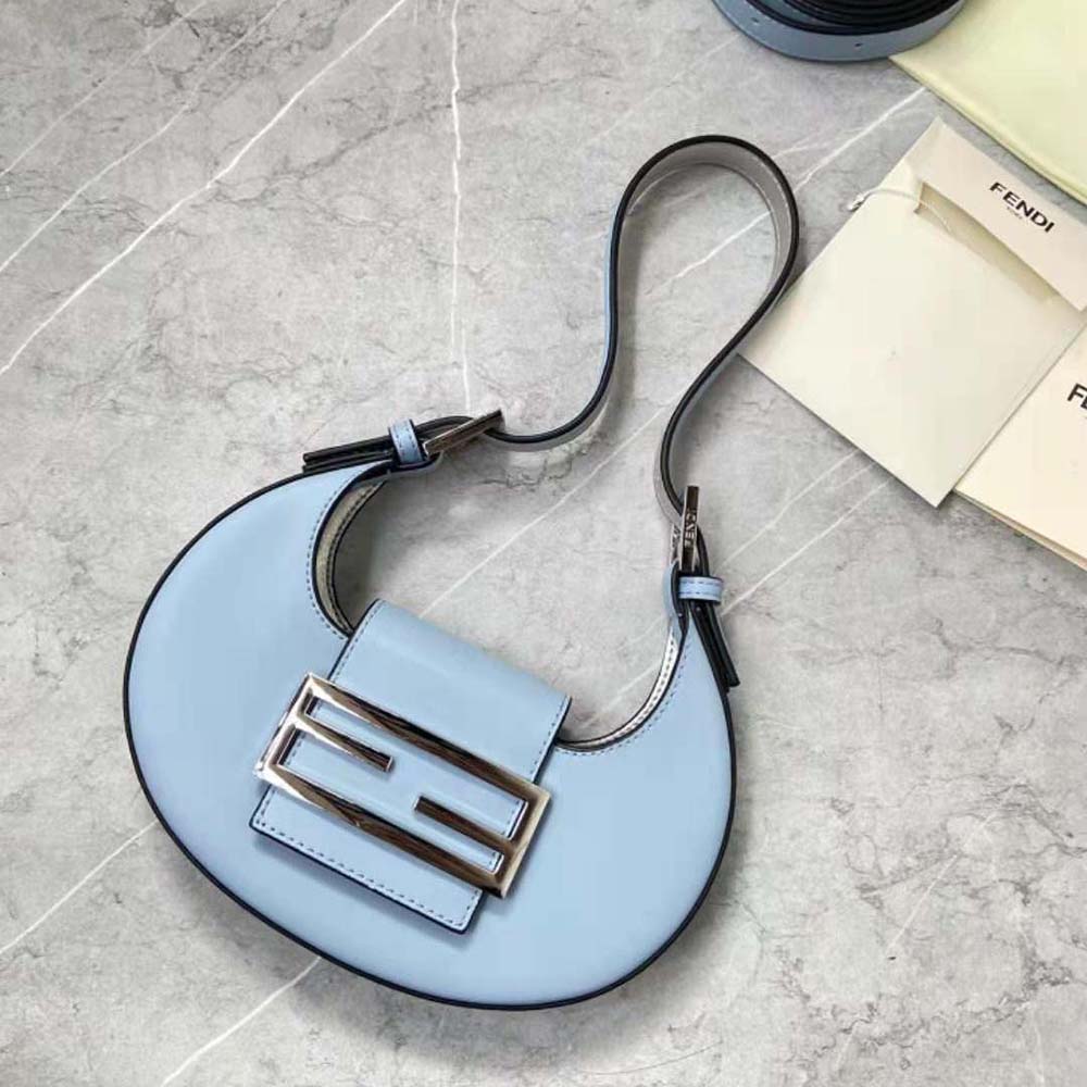 Close-up of gold-tone buckle on Fendi Women Cookie Light Blue Leather Mini Bag