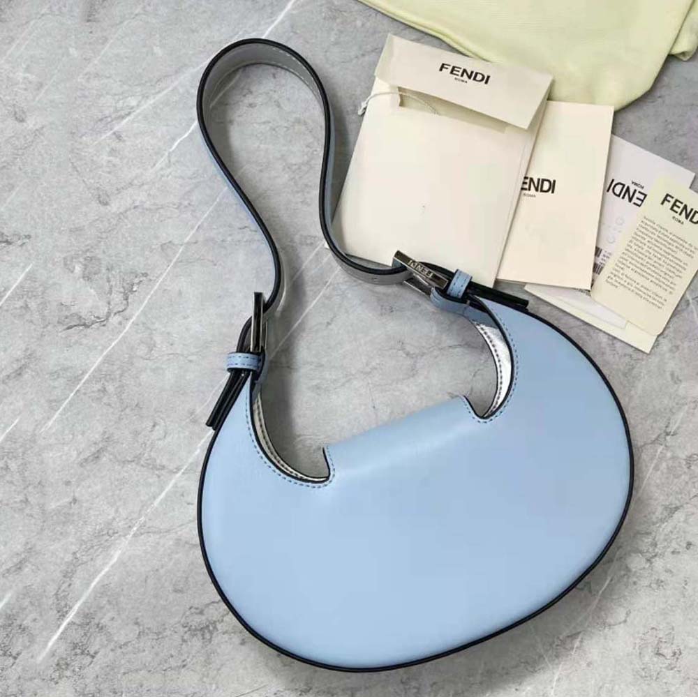 Side angle showing curved silhouette of Fendi Women Cookie Light Blue Leather Mini Bag