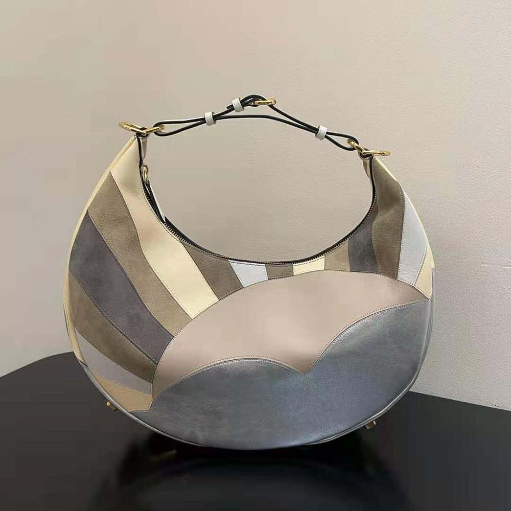 Side angle highlighting brown leather and structured silhouette of Fendi Women Fendigraphy bag