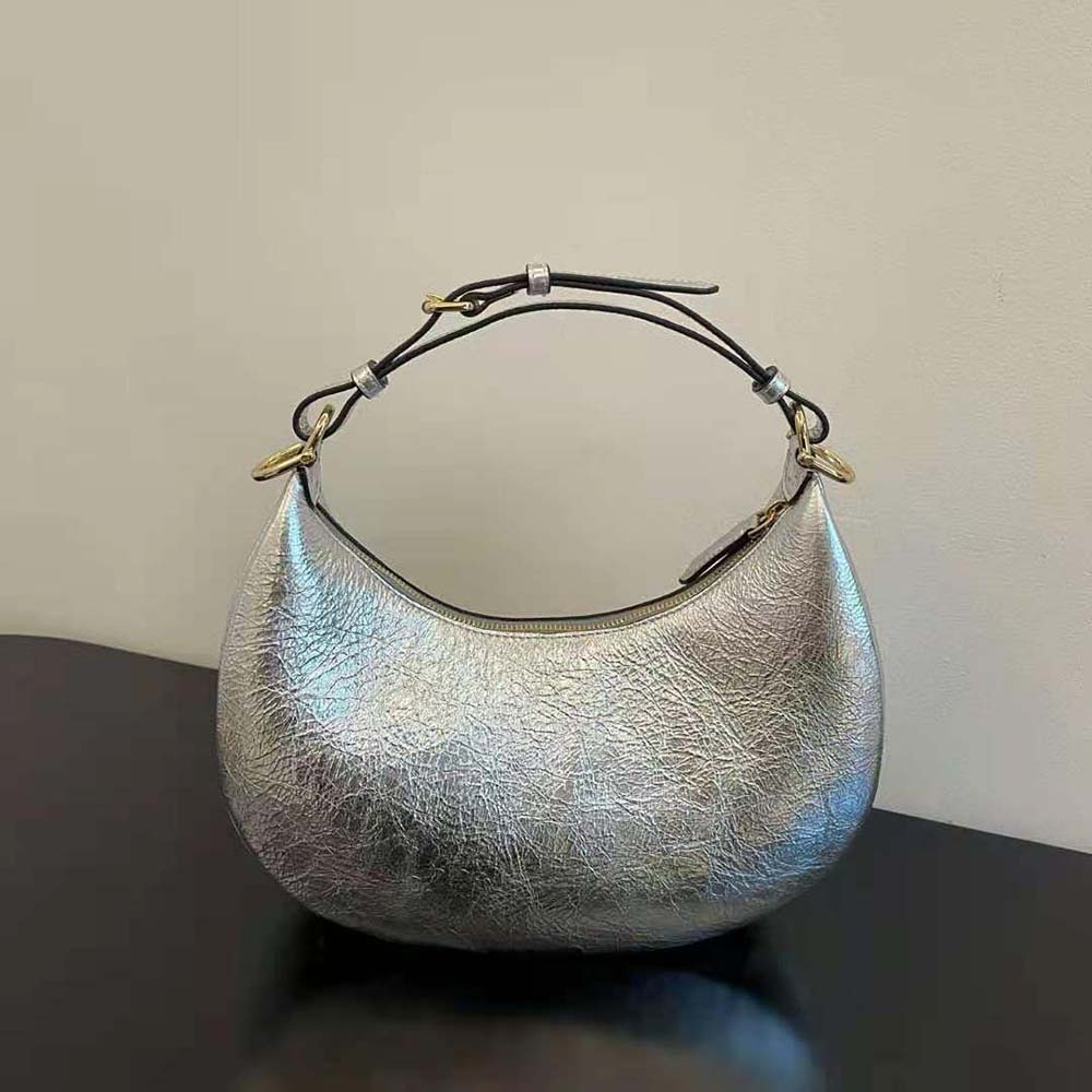 Side view showing magnetic flap and strap of Fendi Women Fendigraphy Bag