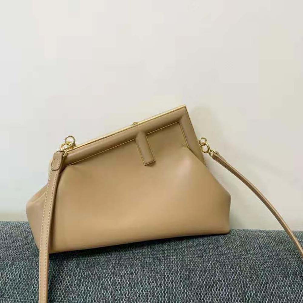 Close-up of gold hardware on Fendi Women First Small Beige Leather Bag