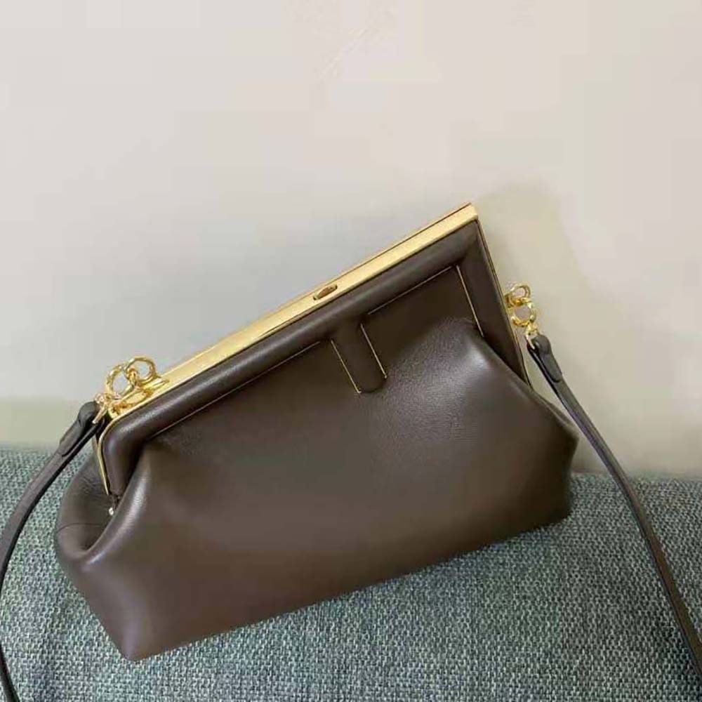 Side angle showing adjustable strap on Fendi Women First Small Dark Brown Leather Bag
