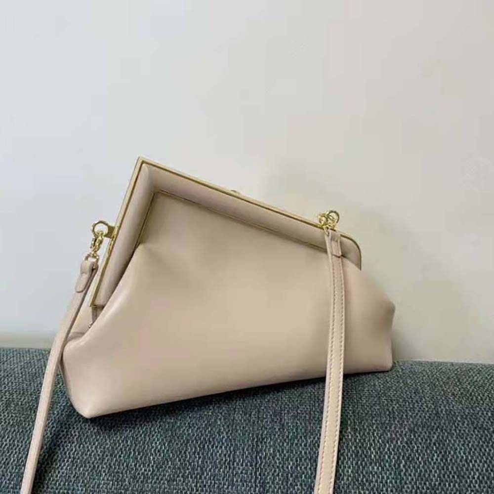 Close-up of push-lock closure on Fendi Women First Small Pink Leather Bag