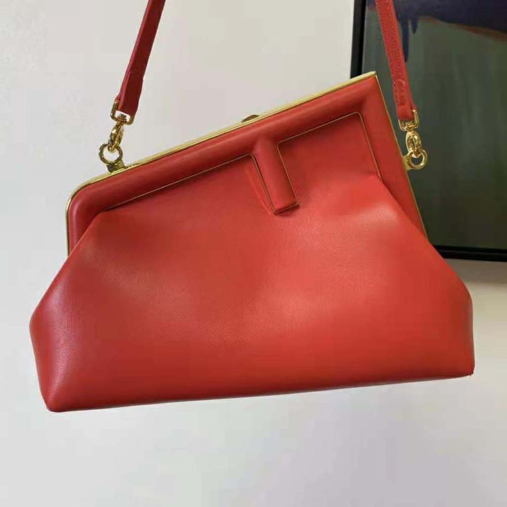 Close-up of gold hardware detail on Fendi Women First Small Red Leather Bag