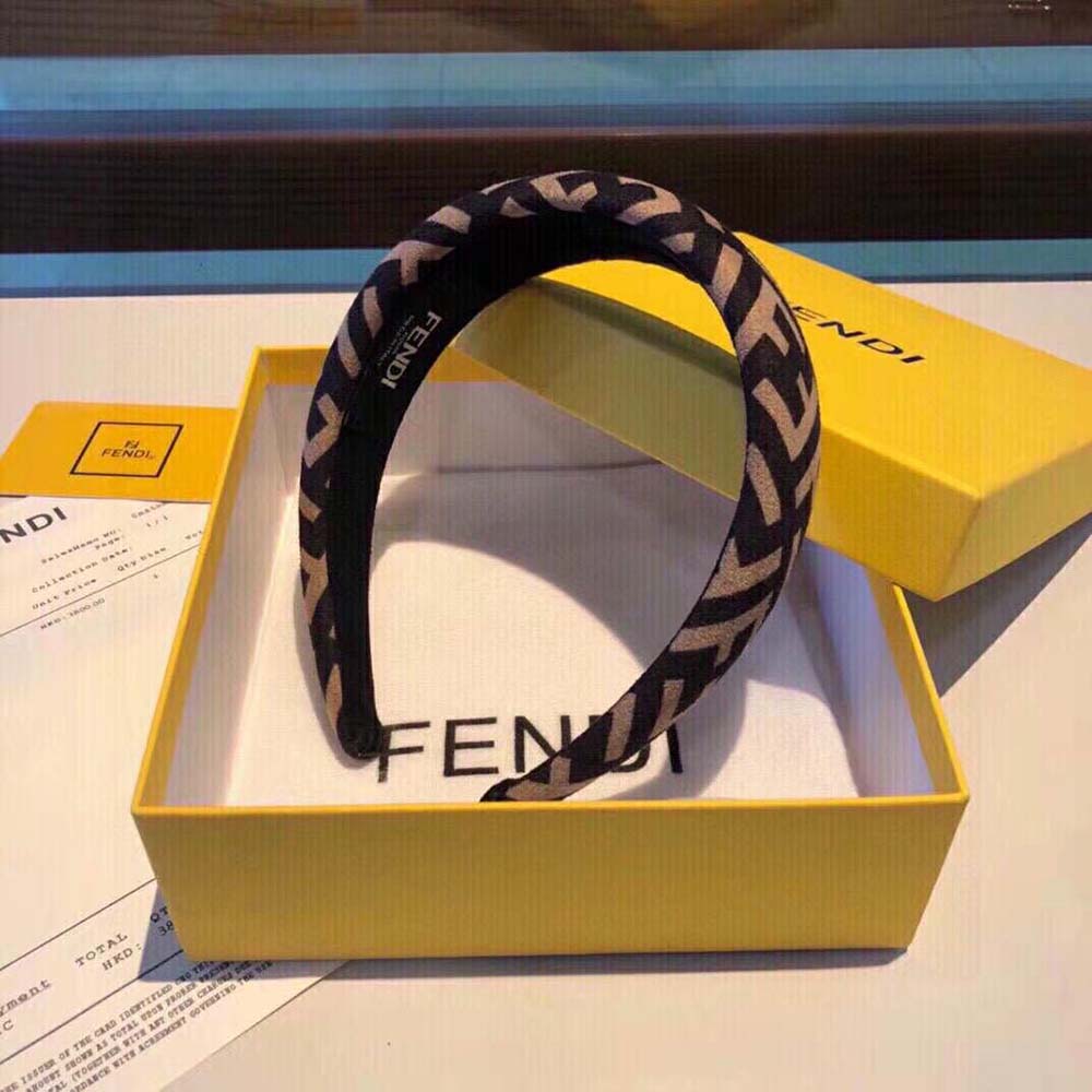 Side angle showing stretch fit of Fendi Women Headband in brown