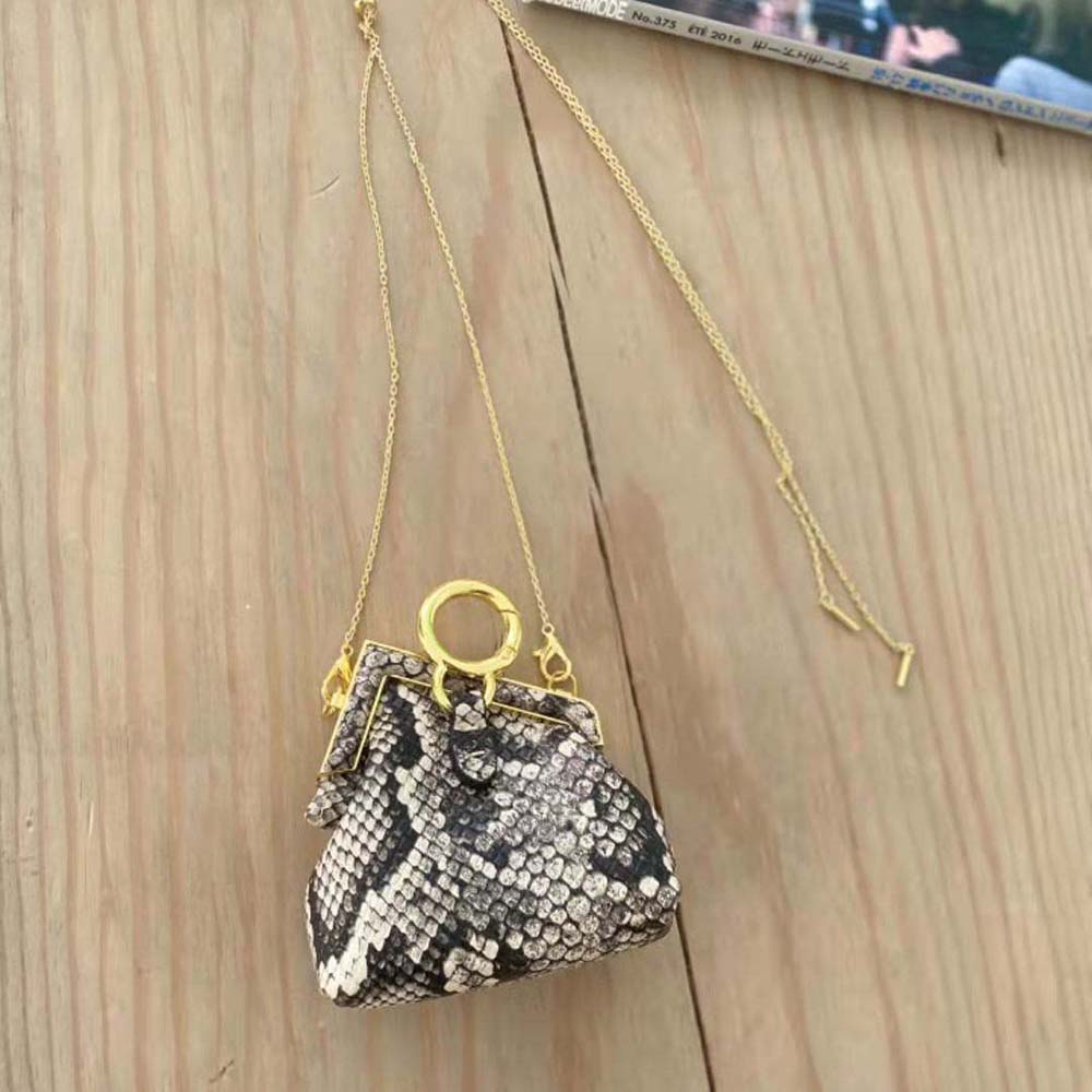 Side angle showing compact silhouette of Fendi Women Nano Fendi First Charm