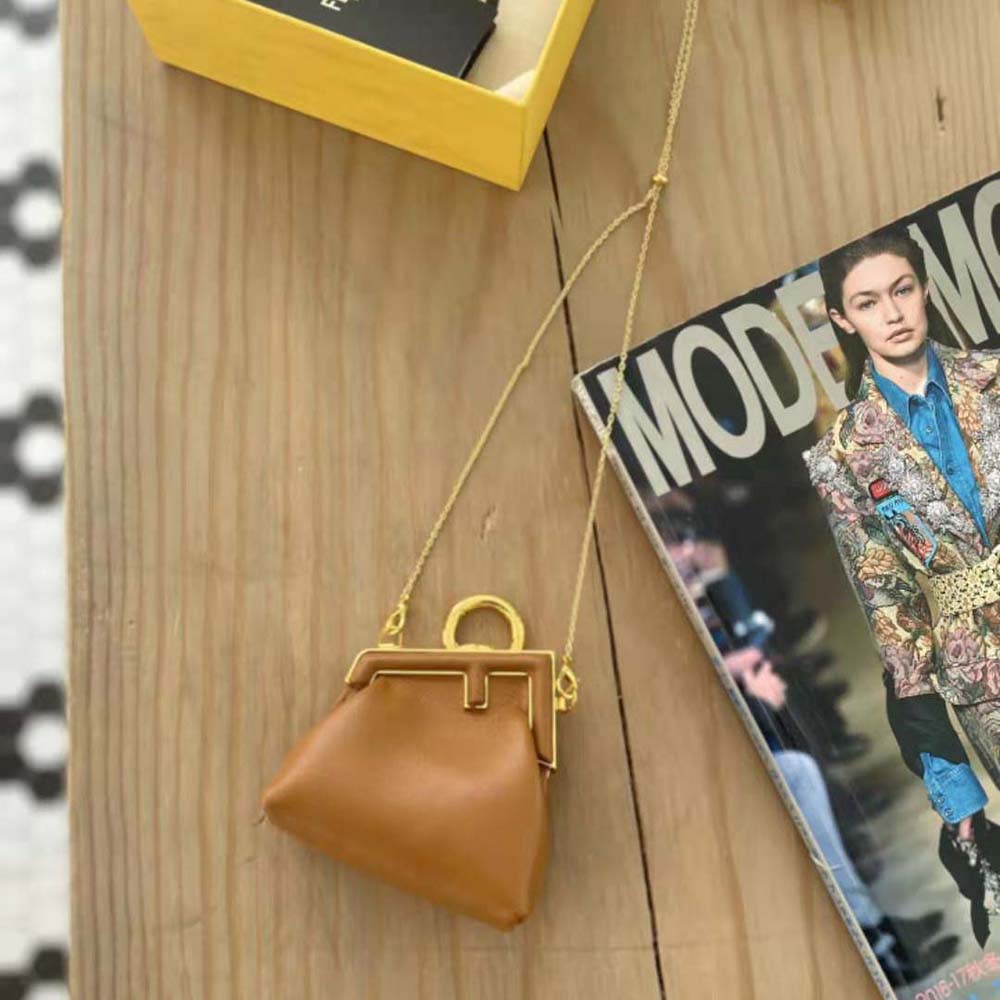 Side angle showing compact silhouette of Fendi Nano Fendi First Charm