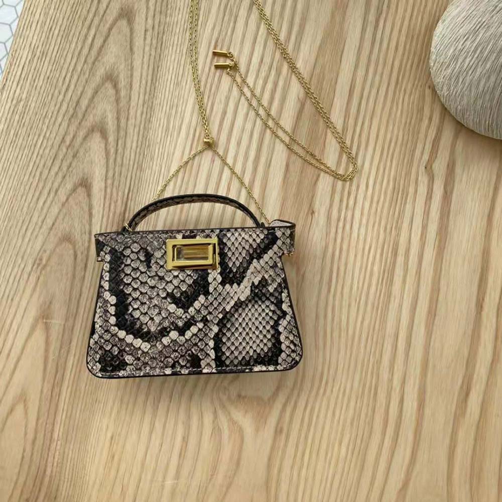 Side angle showing compact size of Fendi Women Nano Peekaboo Charm