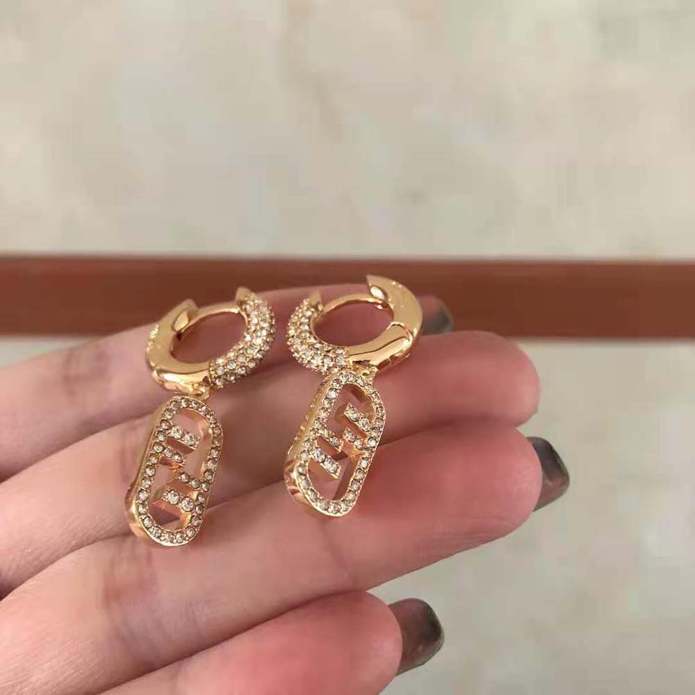 Detail of zircon and gold bronze finish on Fendi Women O Lock Earrings
